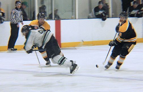 Jeremy McQuillin (L) is dumped off the play by a Milverton player